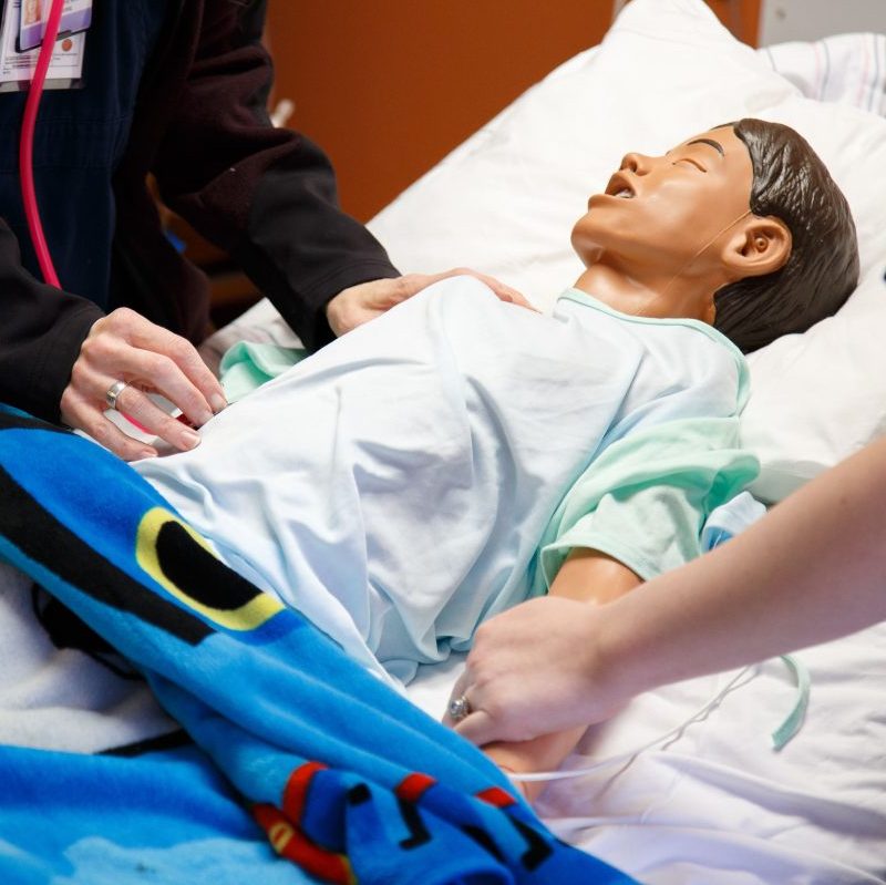 Clinical Simulation of man in hospital bed