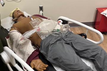 A simulation manikin featured in a cardiopulmonary arrest scenario