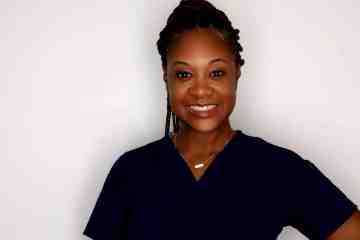 A woman in navy blue medical scrubs